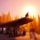 A gas station in the forest at sunset in Road 96
